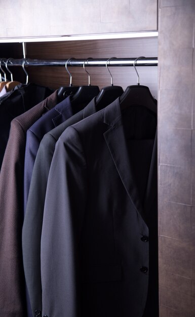 Row of men's suits hanging