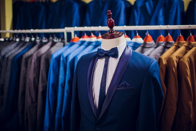 Row men suit jackets on hangers