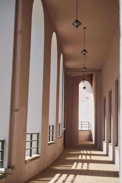 Row of modern columns with diminishing perspective corridor outside the building