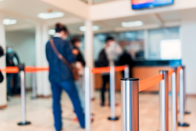 Row of people to the bank teller cashier defocused background