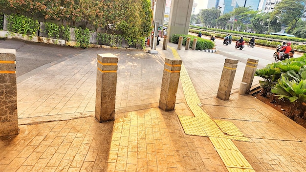 a row of pillars with a yellow stripe on the side