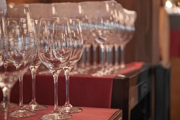 A row of wine glasses on a table