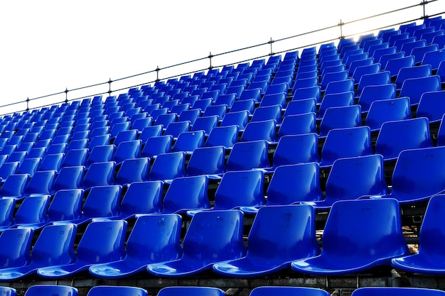 rows of blue seats Temporary stadium