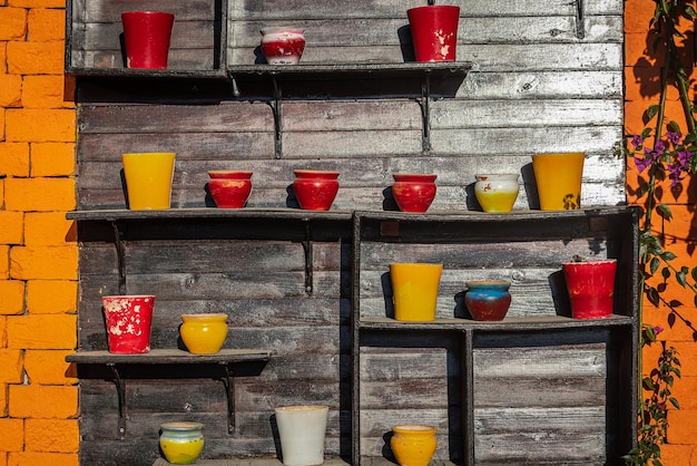 Rows of different pots in a street flowerbed close up