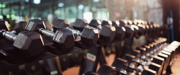 Rows of dumbbells in the gym sports and healthcare concept