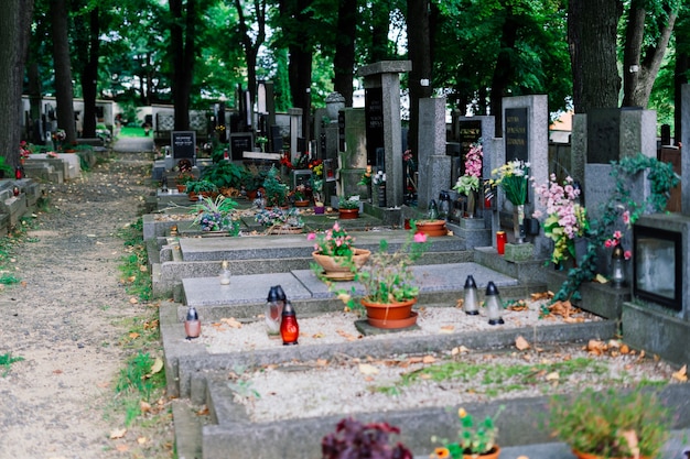 Rows of old abandoned graves in a Catholic cemetery. The rickety gravestones.