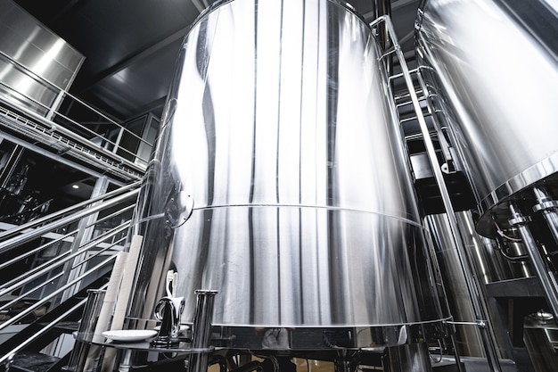 Rows of steel tanks for beer fermentation and maturation in a craft brewery