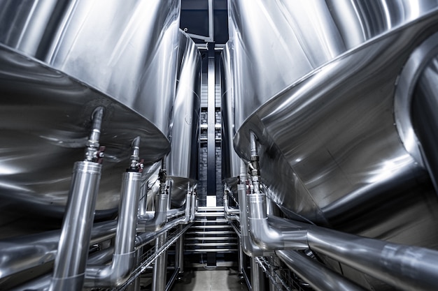 Rows of steel tanks for beer fermentation and maturation in a craft brewery