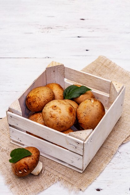 royal champignon mushrooms in wooden crate