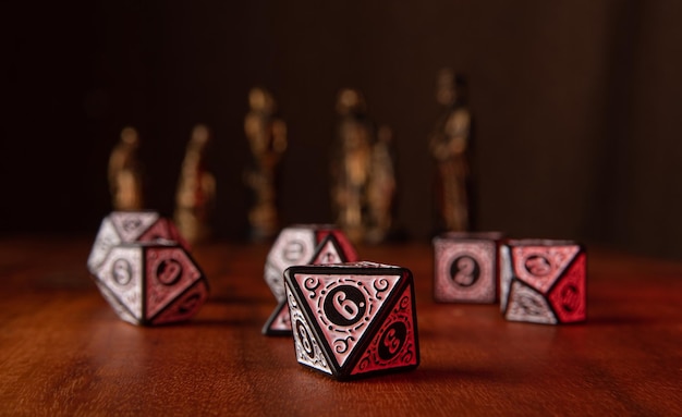 RPG dice beautiful RPG dice on rustic wood dark background with figures selective focus