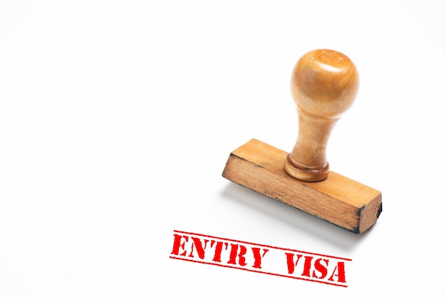 Rubber stamp with entry visa sign on white background. Close up