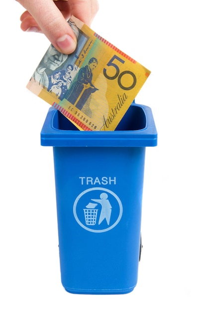 rubbish bin with money