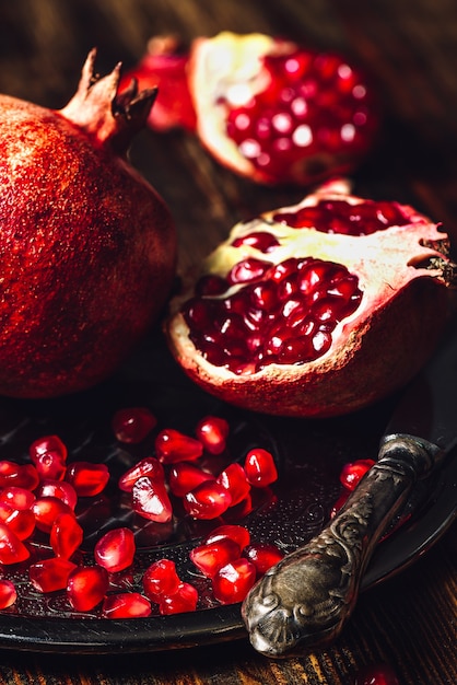 Ruby Pomegranate with Seeds and Knife.