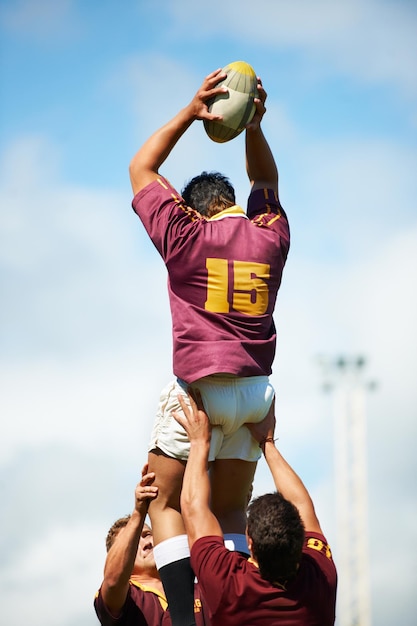 Rugby ball and men with fitness competition and training for wellness exercise and teamwork Professional players group or male athletes with sports match and practice with workout and challenge