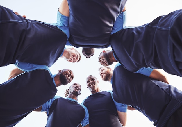 Photo rugby men and huddle of team with smile motivation and pride in competitive game collaboration sports and teamwork below diverse players ready for match workout or tournament on field at club