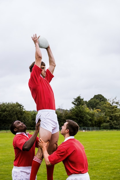 Rugby players jumping for line out