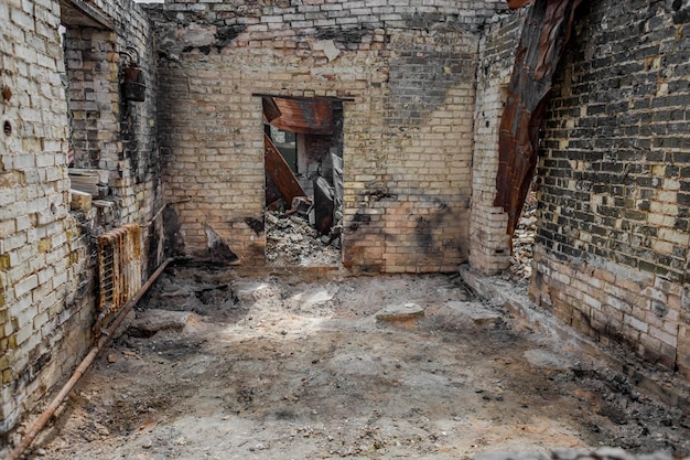 Ruined house. Ruins of a residential building. Brick walls. War in Ukraine.