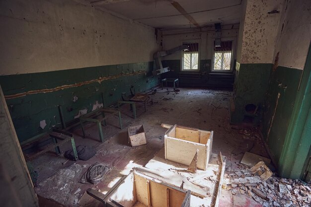 Ruined old houses in Zalyssia village located in Chernobyl Exclusion zone popular dark tourism location Ukraine