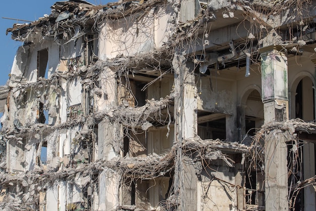 Ruins of destroyed houses, heaps of metal reinforcement concrete.