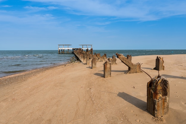 Ruins of the old jetty on the beach.