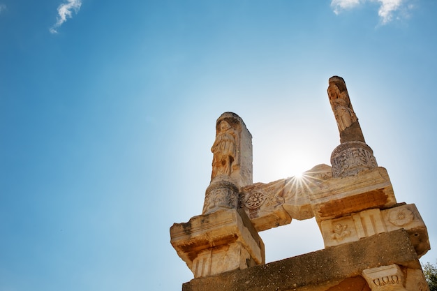 The ruins and ruins of the ancient city of Ephesus against the blue sky on a sunny day.