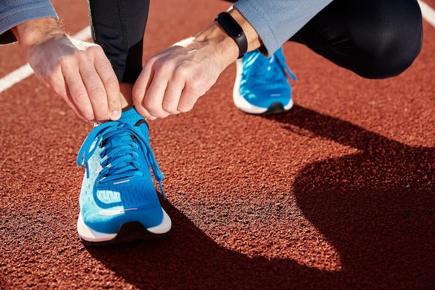 Runner get ready for run tying sneakers shoelaces