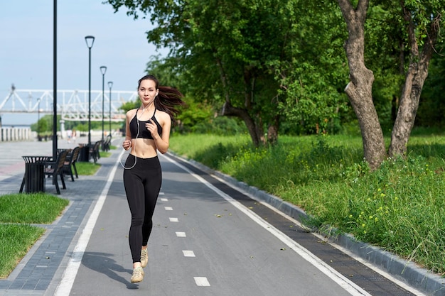 Running asian woman on running track Morning jogging The athlete training