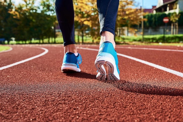 Running sneakers at stadium track