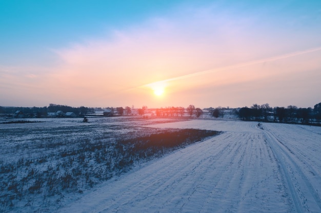 Rural landscape in winter Countryside A field covered with snow at sunset