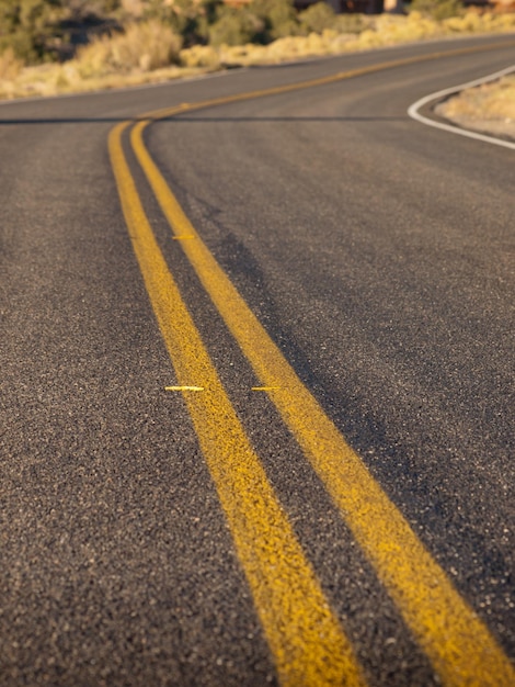 Rural paved road with yellow line.