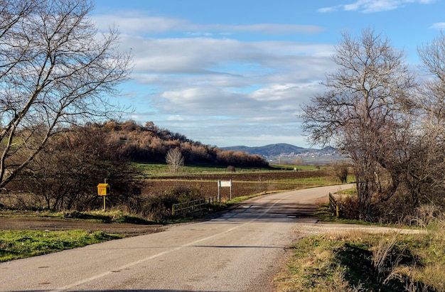 Rural road in the mountains in the winter sunny day Greece