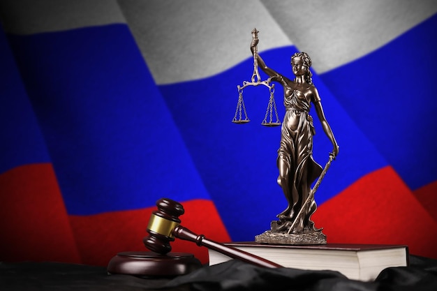 Russia flag with statue of lady justice constitution and judge hammer on black drapery Concept of judgement and guilt