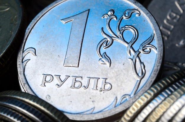 The Russian 1 ruble coin is on other coins. close-up.