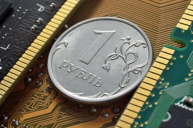 Russian 1 ruble coin lies among the microcircuits a concept illustrating the pricing of electronics in Russia