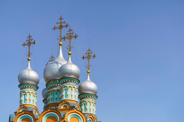 Russian Christian Orthodox church with domes and a cross against the sky Russian Orthodoxy