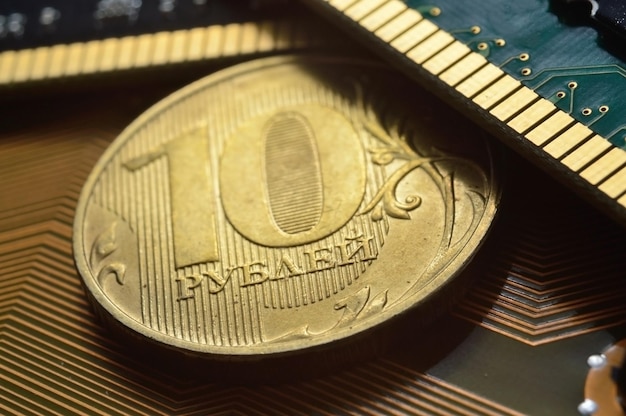 Russian coin with a face value of 10 rubles lies among the microcircuits a concept illustrating the pricing of electronics in Russia