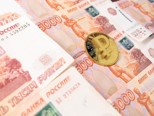 Russian Cryptocurrency standing on the Russian money. Russian Prohibition of bitcoin cryptocurrency.