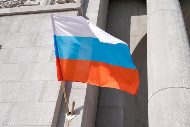 Russian flag Russian flag displayed on a pole in front house National flag