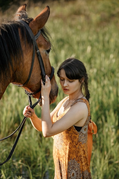 Russian girl on a horse, spring nature, man and animal