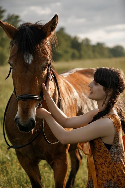 Russian girl on a horse, spring nature, man and animal