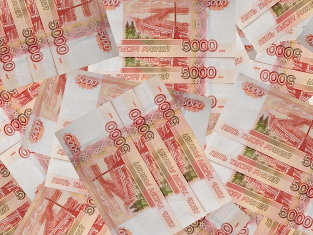 Russian money banknotes background consisting of five thousand Russian rubles banknotes