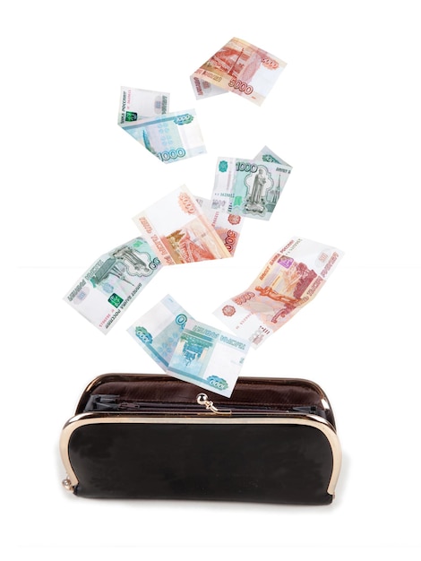 Russian money falling into the purse on a white background