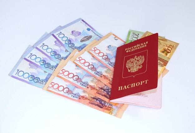 Russian passport and paper banknotes tenge currency Kazakhstan