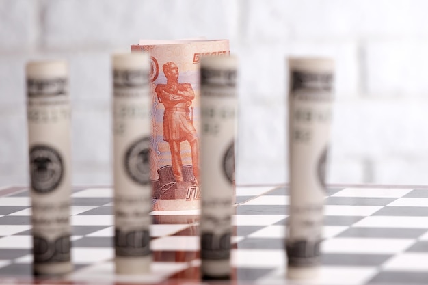 Russian rubles and American dollars on a chessboard