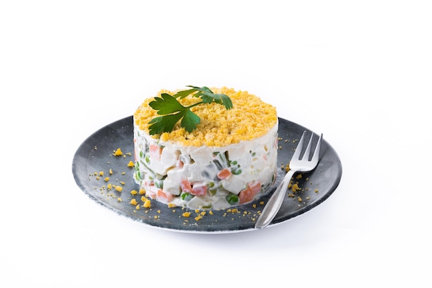 Russian salad or Olivier salad isolated on white background