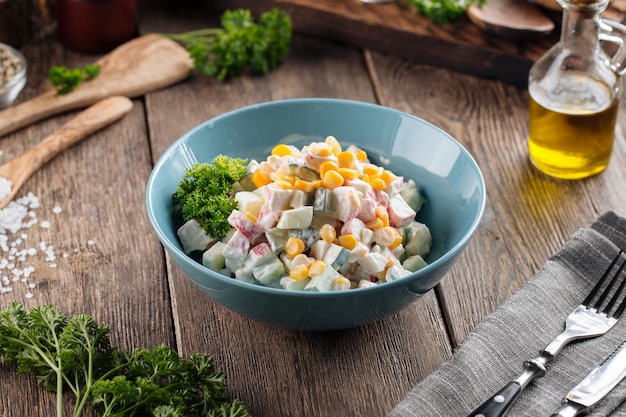 Russian salad with crab and corn