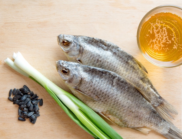 Russian snack with Beer, dried fish, onion and sunflower seeds