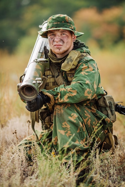 Russian soldier in the battlefield with a rifle