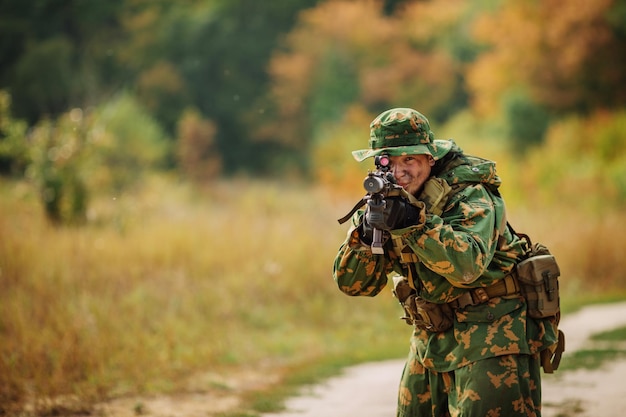 Russian soldier in the battlefield with a rifle