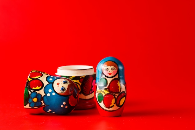 Russian traditional matreshka on red surface